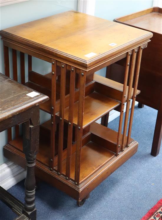 An Edwardian Maple & Co walnut revolving bookcase W.49cm